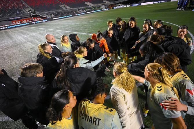 Vancouver Rise FC huddles together after a game.