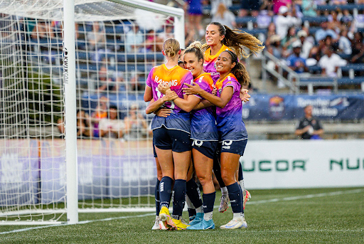 USL Super League players celebrate during a game.