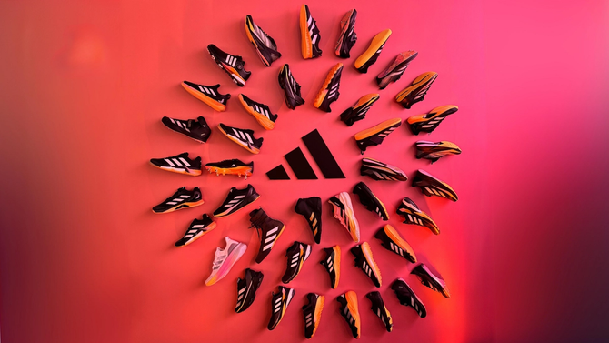 adidas shoes on a wall around the adidas logo
