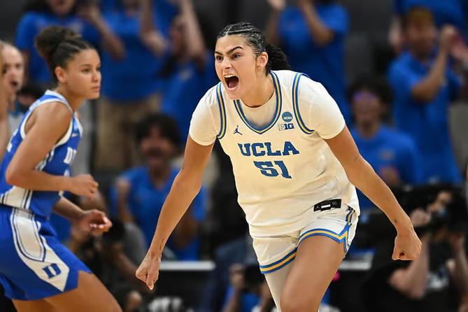 UCLA’s Lauren Betts celebrates after a bucket.