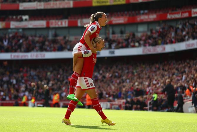 Beth Mead of Arsenal celebrates with teammate Katie McCabe after scoring their team's first goal during the FA Women's Super League match between Arsenal and Tottenham Hotspur at Emirates Stadium on September 24, 2022 in London, England.