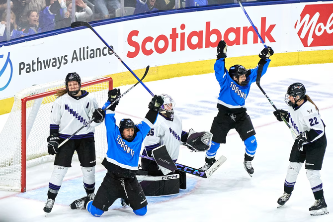PWHL Toronto players celebrate during a game against PWHL Minnesota