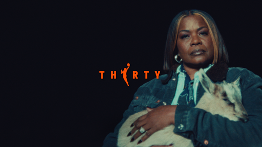 WNBA legend Sheryl Swoopes poses with goat for WNBA Thirty campaign spot.