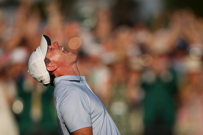 Rory McIlroy celebrates after winning second consecutive Masters.