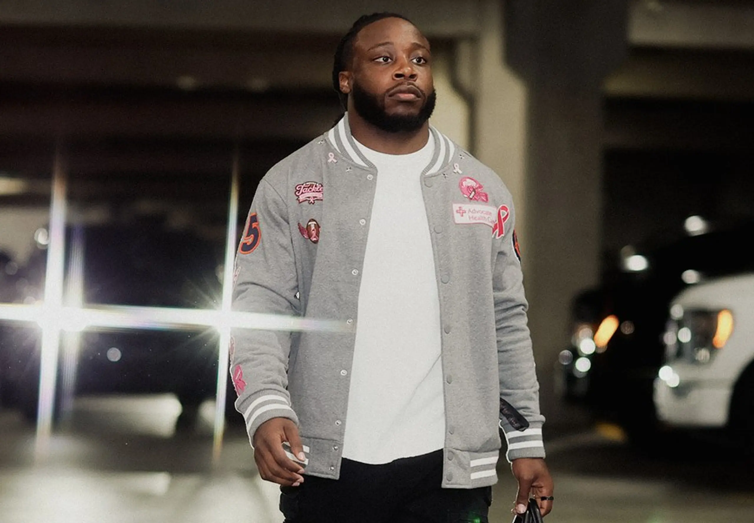 Chicago Bears running back Kyle Monangai wearing his custom jacket from Brenda.