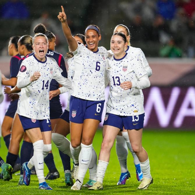 Emily Sonnett, Lynn Williams, and Olivia Moultrie celebrating