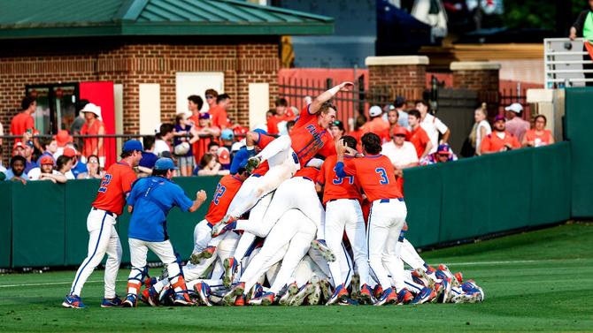 The Florida baseball team dogpiles after a walk-off RBI seals their Super Regional victory over No. 6 Clemson yesterday.