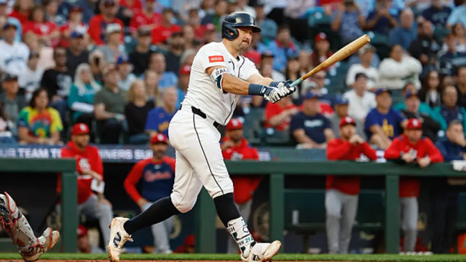 Cal Raleigh swinging a baseball bat