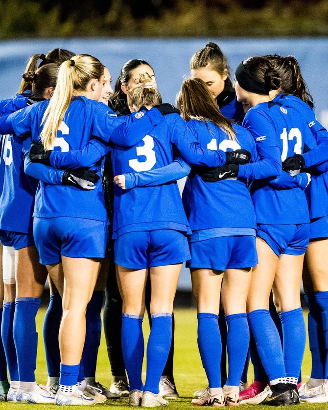 The No. 1 Duke women’s soccer team huddles together before a match.