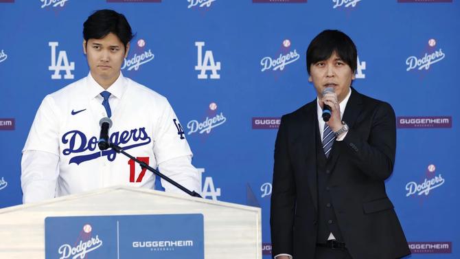 LA Dodger Shohei Ohtani attends his introductory press conference with interpreter Ippei Mizuhara