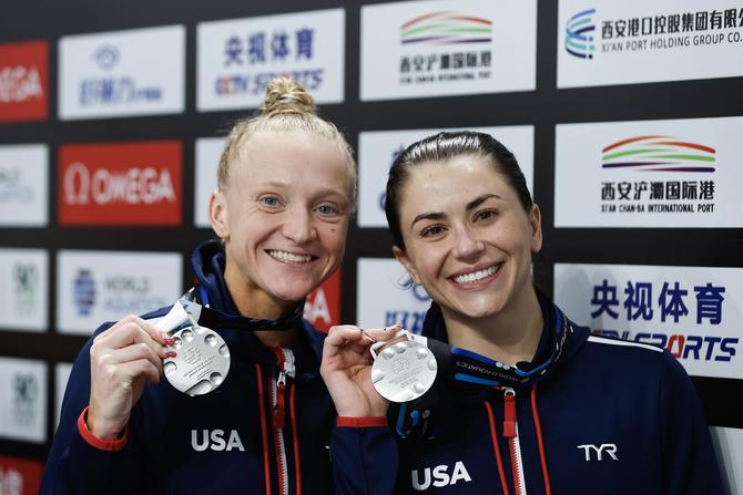 Sarah Bacon and Kassidy Cook of the United States pose with their silver medals after the award ceremony for the Women's Synchronized 3m Springboard Final during the World Aquatics Diving World Cup 2024 at the Xi'an Aoti Aquatic Centre on April 19, 2024 in Xi An, China.