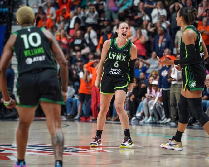 The Minnesota Lynx's Bridget Carleton yells in celebration after hitting the game-winning three in the Lynx's game against the Connecticut Sun.