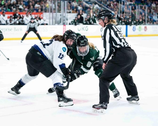 PWHL Boston and Minnesota players prepare for a faceoff