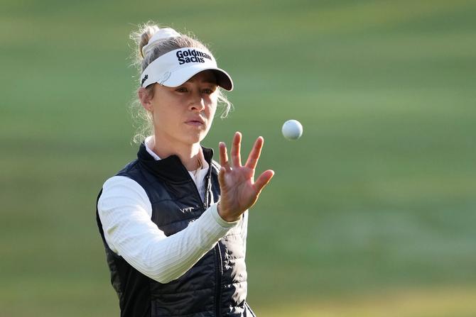 Nelly Korda of the United States catches a ball on the third green during the first round of the Kroger Queen City Championship presented by P&G 2024 at TPC River's Bend.