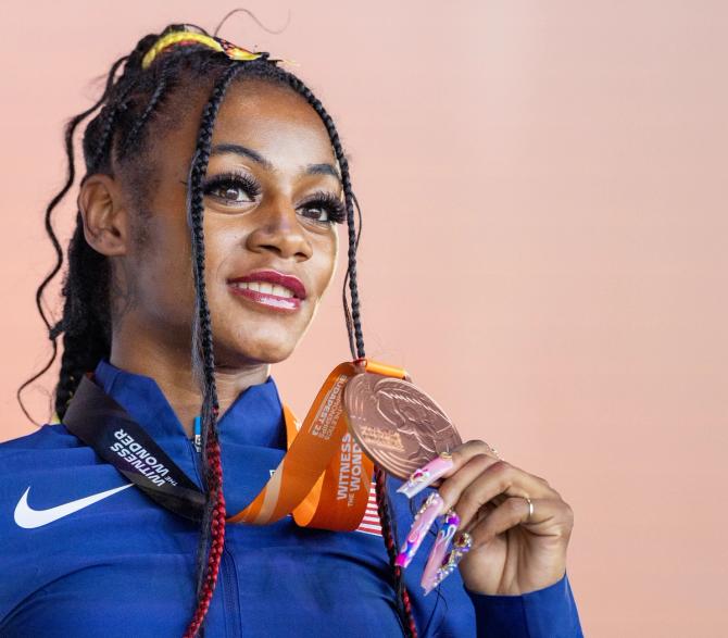 Sha'Carri Richardson of the United States on the podium with her bronze medal won in the Women's 200m Final during the medal ceremony at the medal plaza during the World Athletics Championships, at the National Athletics Centre on August 26th, 2023 in Budapest, Hungary.