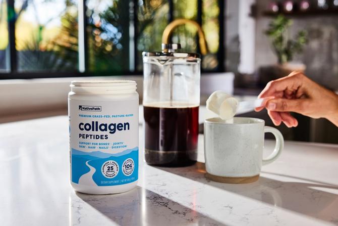 A person pouring NativePath collagen peptides into a mug