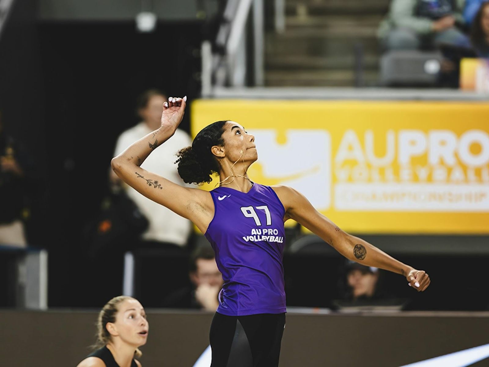 Jordan Thompson serves the ball during an AU match.