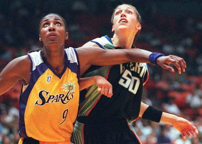 The LA Sparks’ Lisa Leslie and the NY Liberty’s Rebecca Lobo battle for a rebound during the WNBA’s first-ever game on June 21, 1997.