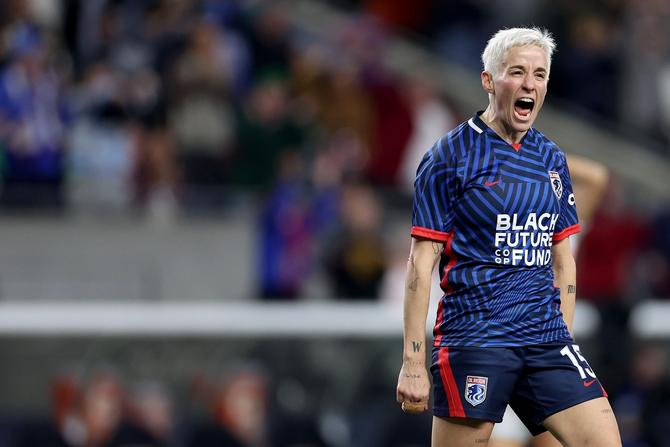 Megan Rapinoe #15 of OL Reign celebrates a goal by Veronica Latsko #24 during the second half against the Angel City FC at Lumen Field on October 20, 2023 in Seattle, Washington.