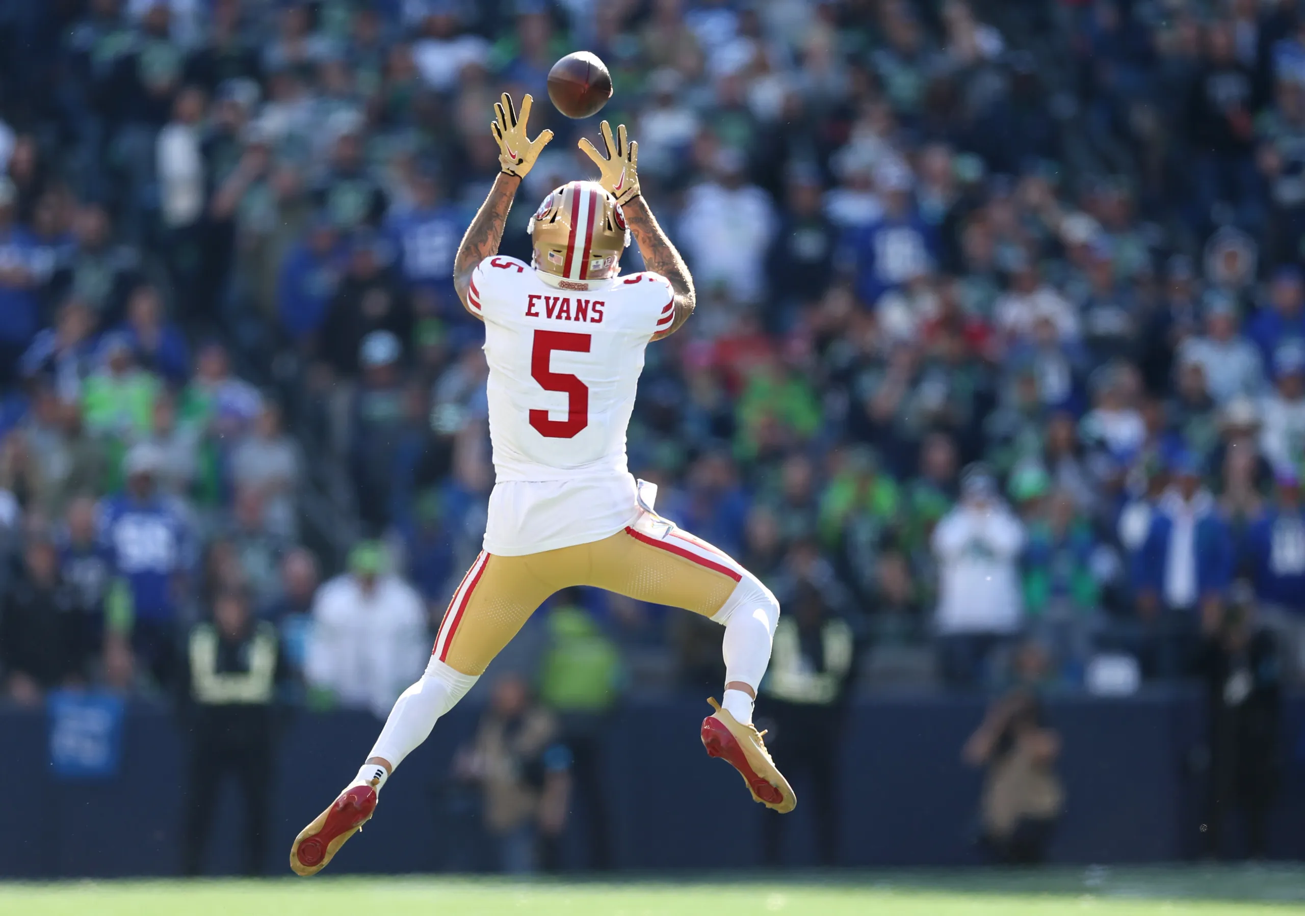 San Francisco 49ers wide receiver Mike Evans makes a leaping catch.