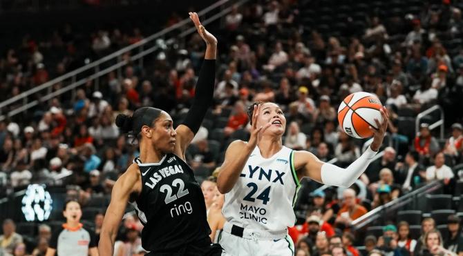 Minnesota Lynx Napheesa Collier drives to the basket against Las Vegas Ace A’ja Wilson.