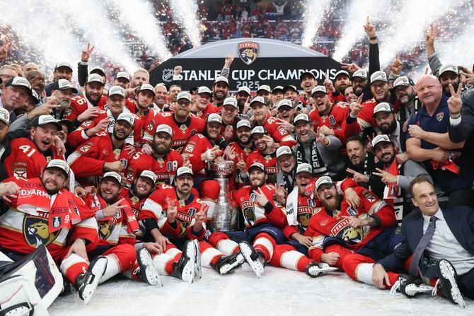 The Florida Panthers celebrate with the Stanley Cup after defeating the Edmonton Oilers in Game Six of the 2025 Stanley Cup Final