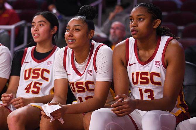 USC Trojans guard Kayla Padilla (45), USC Trojans guard JuJu Watkins (12) and USC Trojans forward Rayah Marshall (13) look on from the bench during the women's college basketball game between the Cal Poly Mustangs and the USC Trojans on November 28, 2023 at Galen Center in Los Angeles, CA.