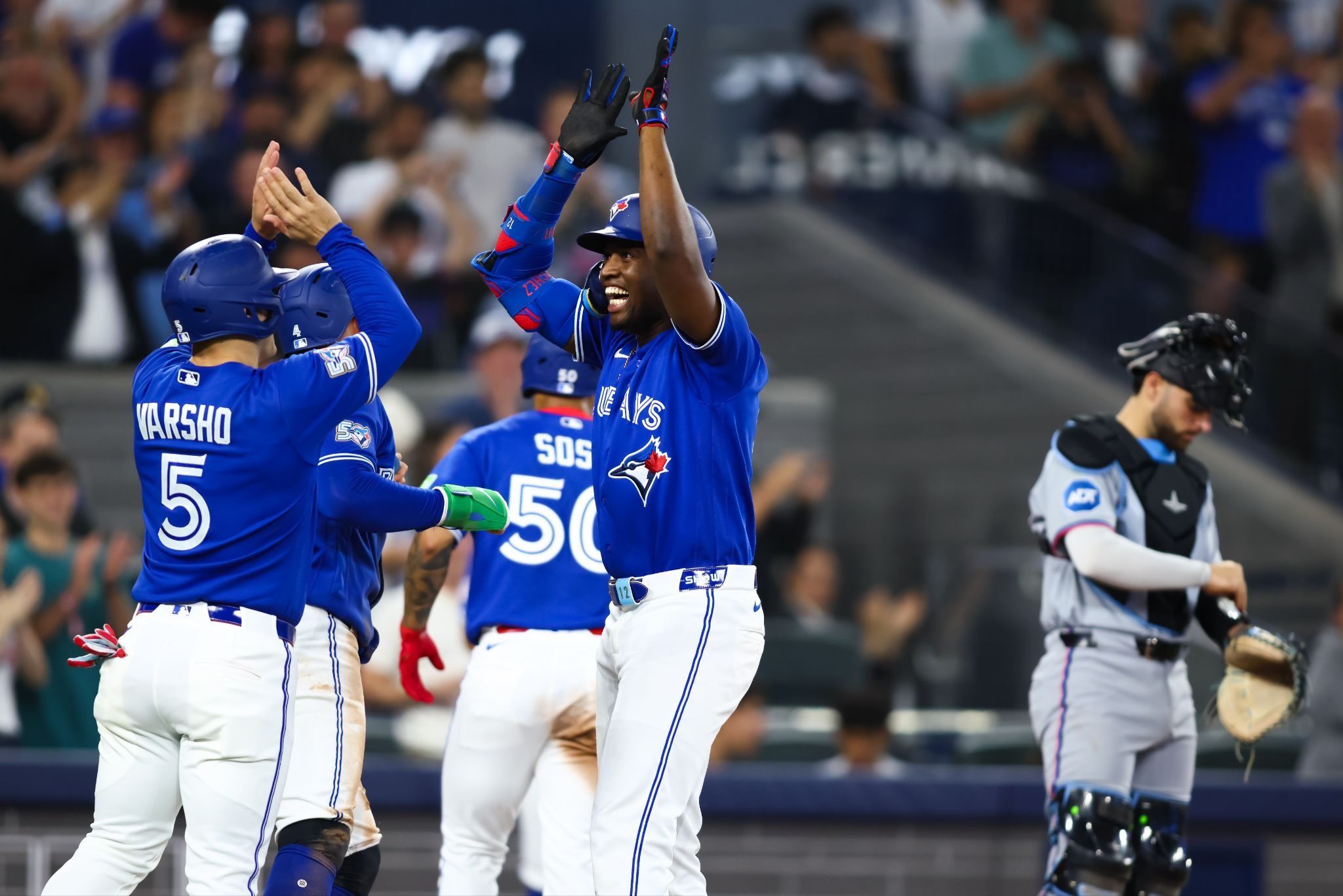 Toronto Blue Jays outfielder Jesús Sanchez celebrates with teammate Daulton Varsho after hitting his first-ever career grand slam.
