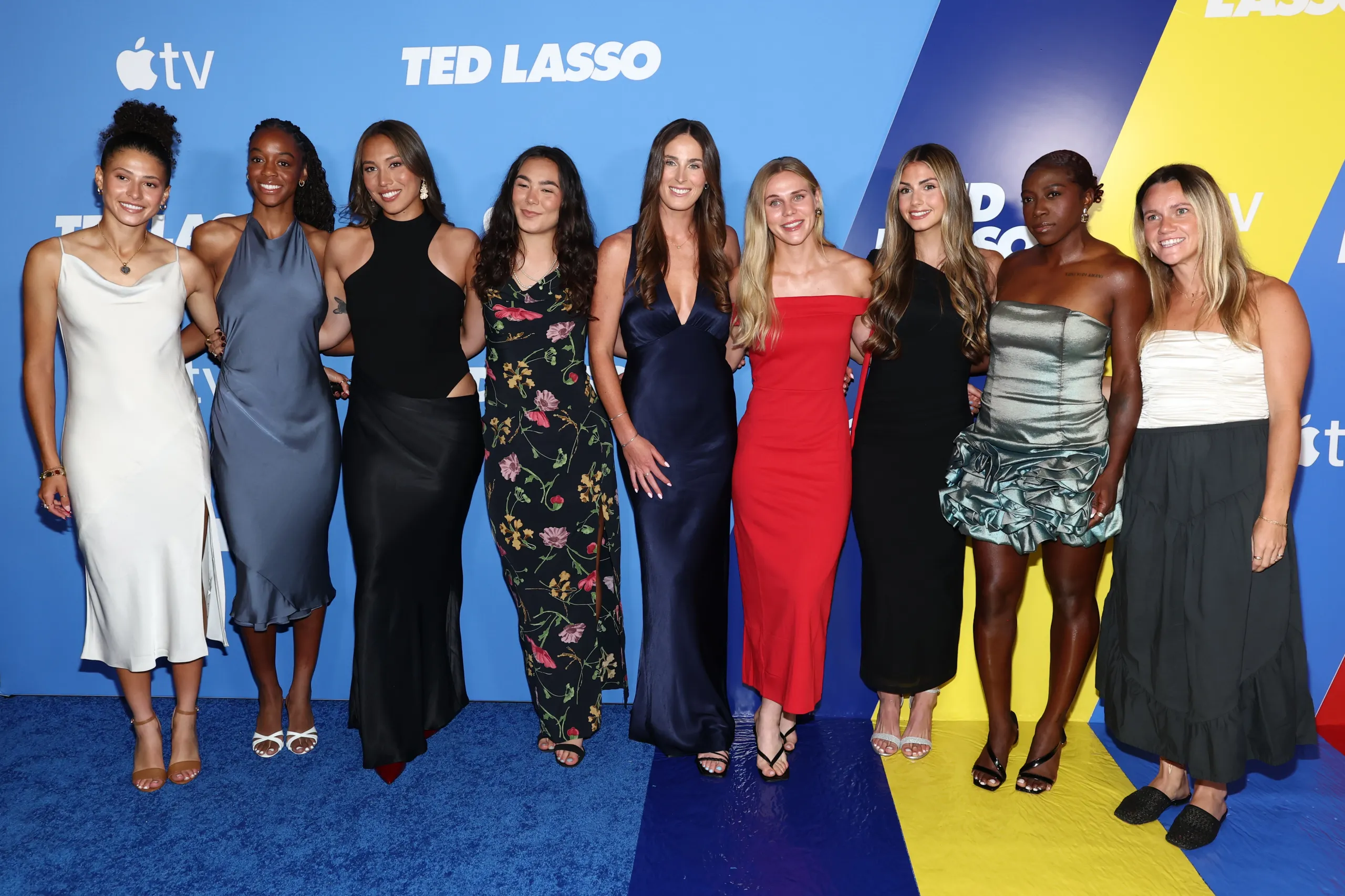 Members of the Ted Lasso cast pose for a photo at the show’s Season 4 premiere in New York.