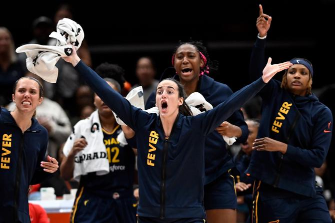 Indiana Fever guard Caitlin Clark, center, who sat out most of the second half with her starting teammates, reacts to a failed game-winning Fever shot attempt in the final seconds of a 92-91 loss to the Washington Mystics during a WNBA game at the Capital One Arena in Washington, DC on September 19, 2024.