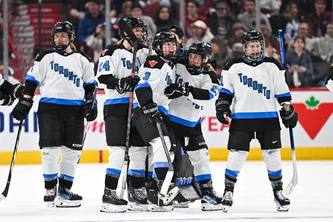 A photo of PWHL Toronto players on the ice celebrating