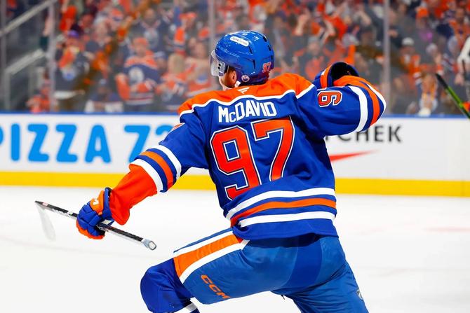 Edmonton Oiler Connor McDavid celebrates on the ice.