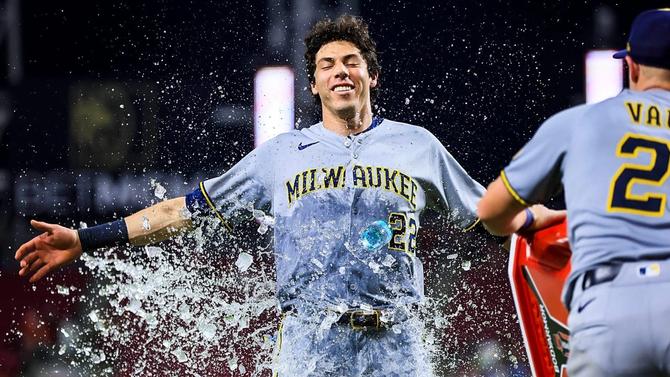 Christian Yelich gets water dumped on him after a win.