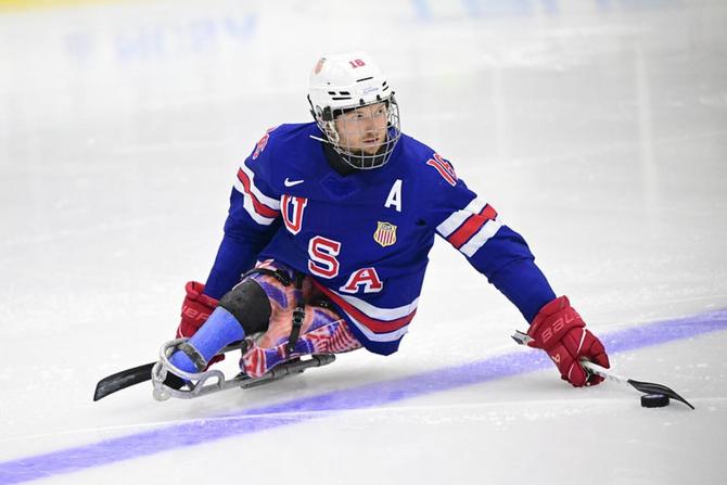 Declan Farmer skates for Team USA in para ice hockey.