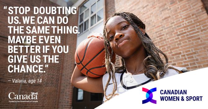 Valaria holding a basketball outside a building