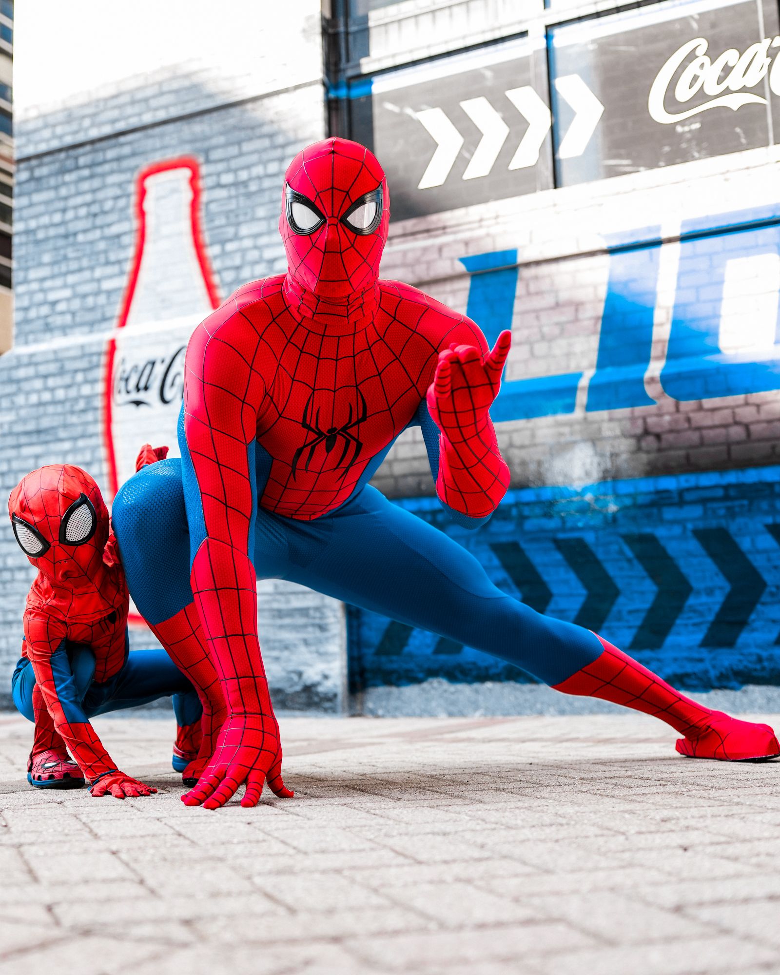 Detroit Lions linebacker Derrick Barnes and his son pose in matching Spider-Man costumes.
