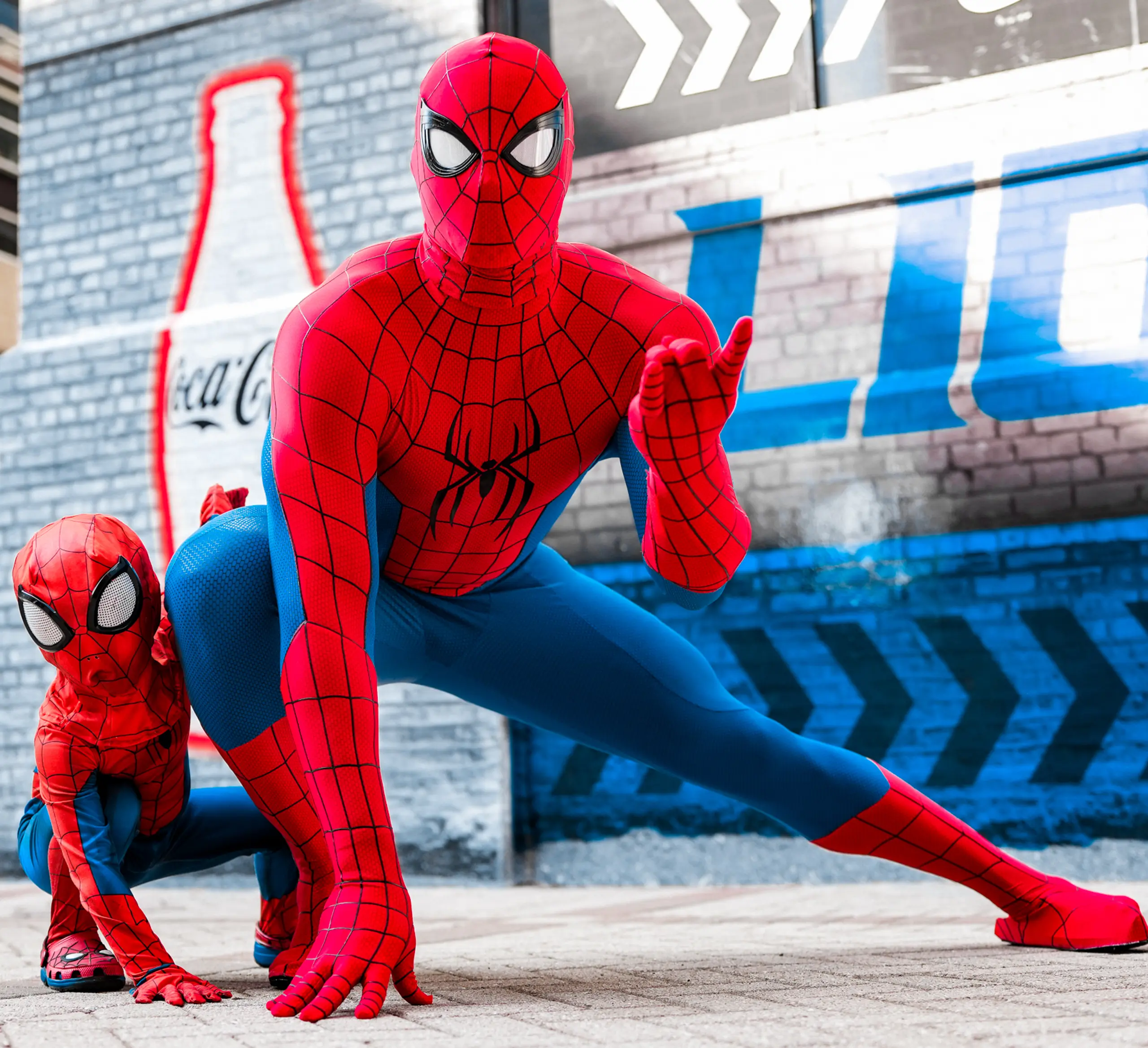 Detroit Lions linebacker Derrick Barnes and his son pose in matching Spider-Man costumes.