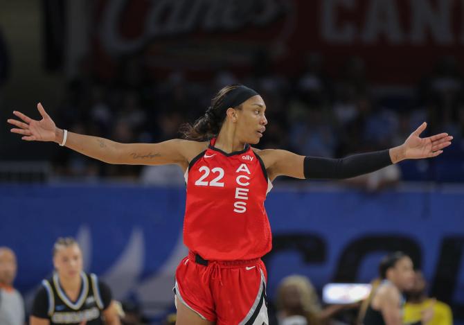 A'ja Wilson #22 of the Las Vegas Aces shoots the game winning shot during the second half of a WNBA game.