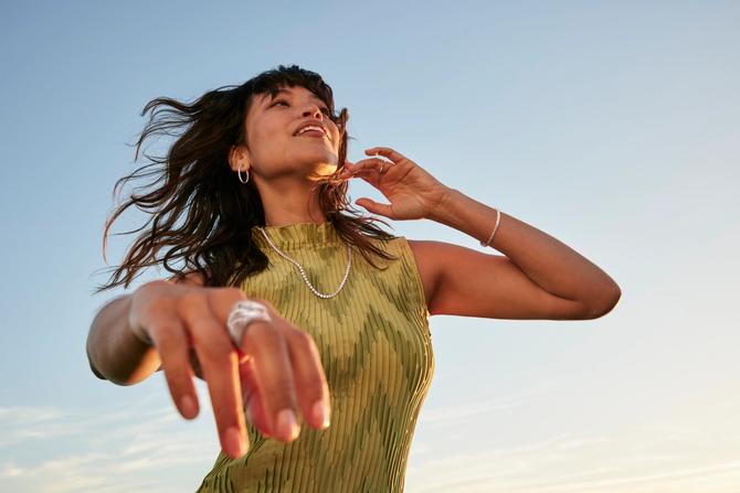 A woman showing off her jewelry