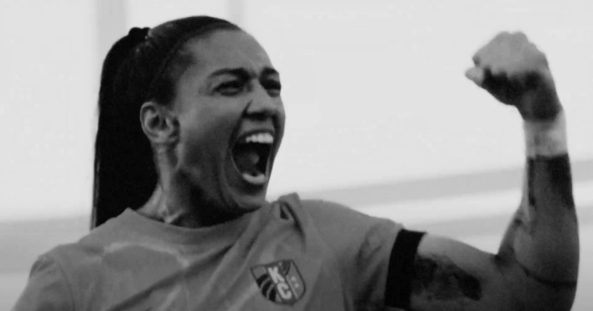 An image of an NWSL athlete celebrating.