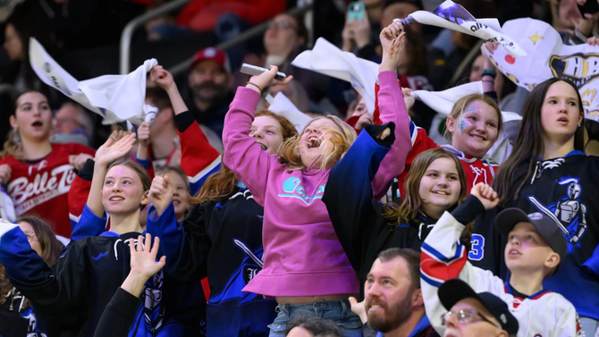 Fans get excited during the first period of a PWHL game between the New York Sirens and the Minnesota Frost, at Little Caesars Arena, in Detroit, Sunday, March 16, 2025.
