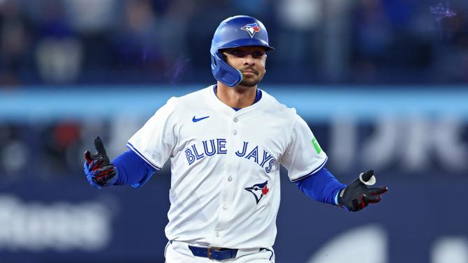 Toronto Blue Jays second baseman Andrés Giménez shrugs after a home run.