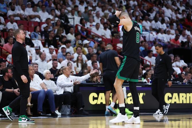 Kristaps Porziņģis #8 of the Boston Celtics leaves the game.
