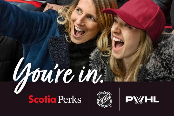 Two hockey fans posing for a selfie