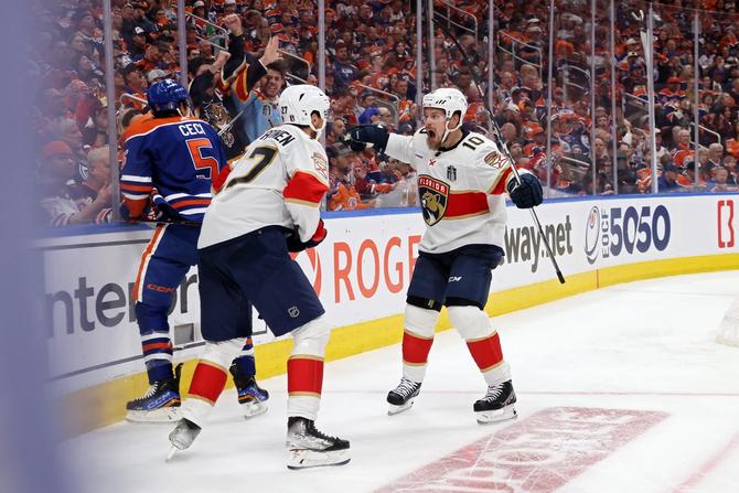 Eetu Luostarinen #27 and Vladimir Tarasenko #10 of the Florida Panthers celebrate after Tarasenko's goal against the Edmonton Oilers during the second period of Game Three of the 2024 Stanley Cup Final