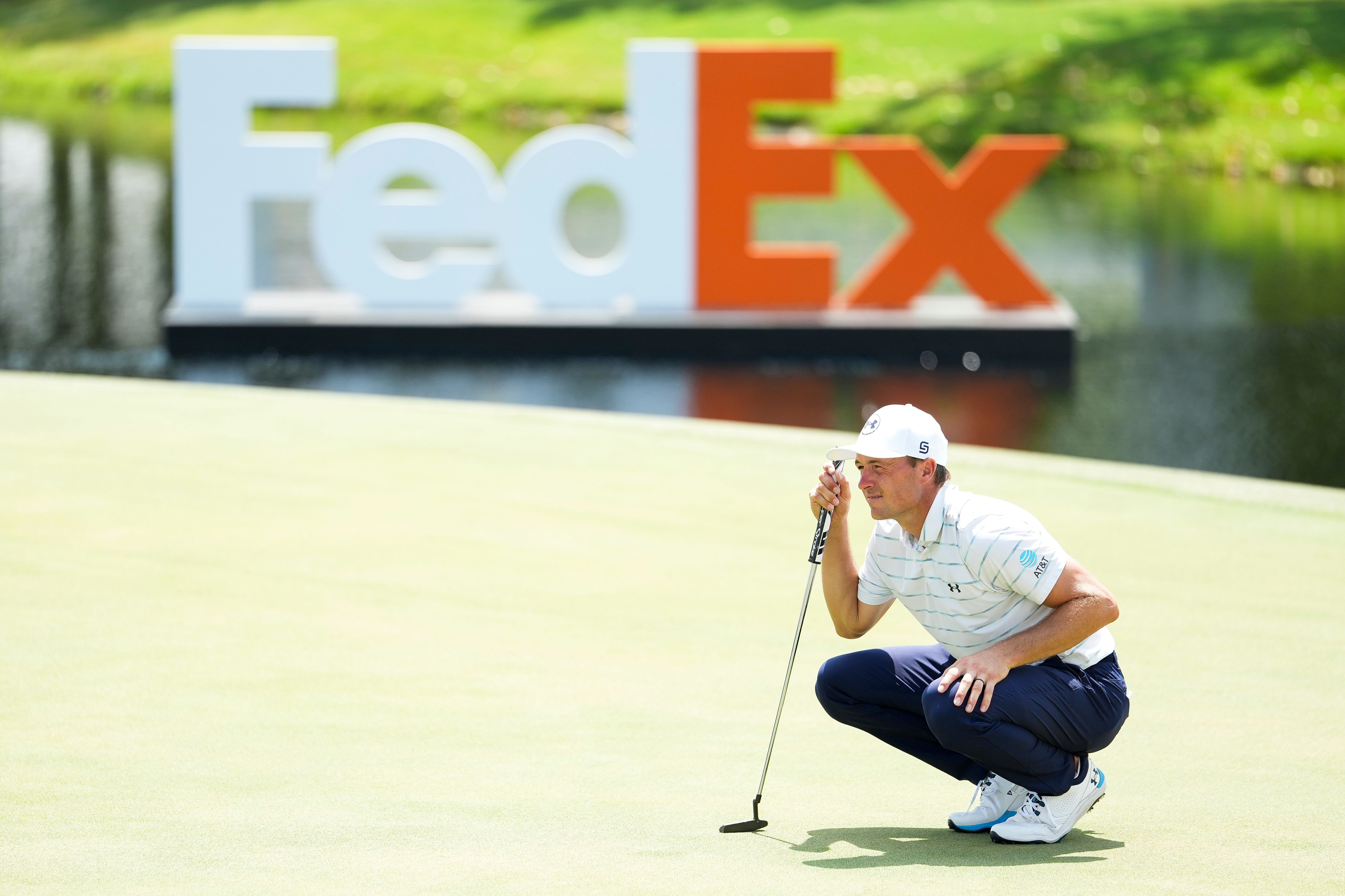 Jordan Spieth of the United States looks over a putt on the 18th hole.