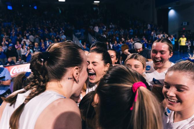 The Creighton volleyball team celebrates after earning a spot in the Sweet 16