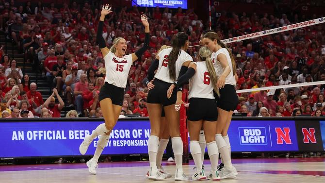 Nebraska volleyball team celebrates after a point.