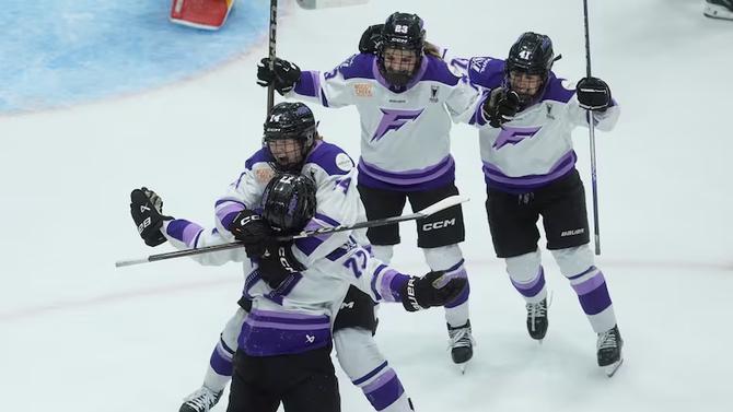 Minnesota Frost celebrate after winning Game 2 of the PWHL Finals.