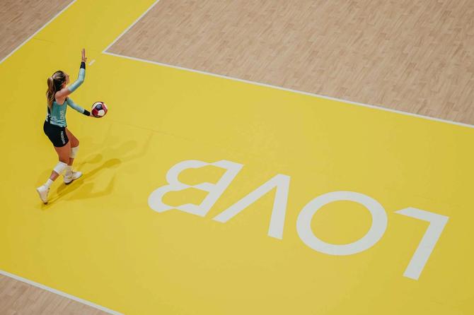 A volleyball player serving